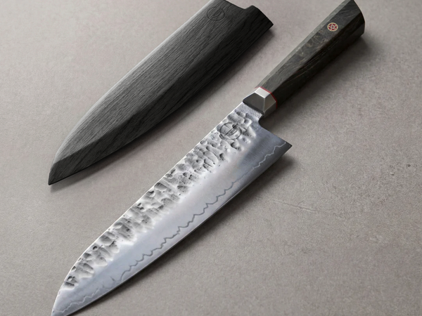 Hand-forged chef knife blade, the kind of high-carbon stainless construction 440C steel competes with