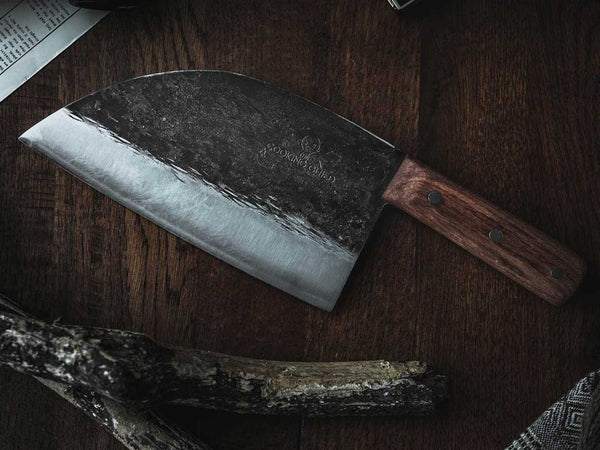 Full tang kitchen knife with the steel visible through the pinned handle