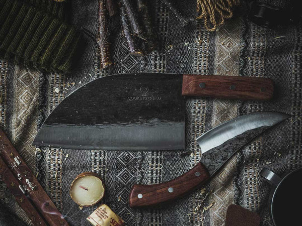 Chef knife blade close-up illustrating the Rockwell hardness scale HRC rating of kitchen knife steel