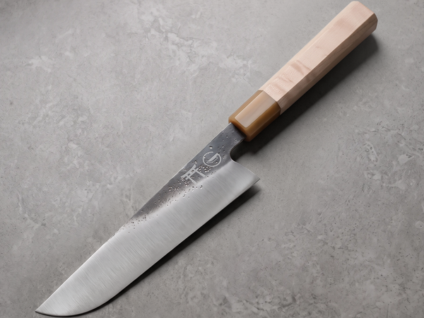 Torii 8-inch gyuto hand-forged from 7Cr17MoV high carbon steel on a wooden board