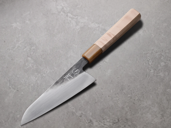 Hand-forged Torii 7 inch chef knife, shaped by hammer from a bar of steel rather than cut from a flat sheet