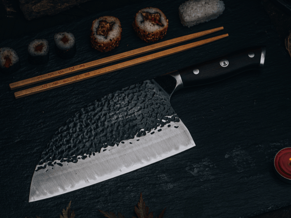 How to use a meat cleaver: a hand-forged cleaver chopping on a wooden board