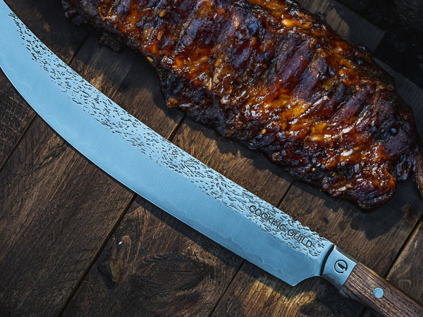 Long slicing knife cutting thin slices from a smoked brisket flat on a wooden board