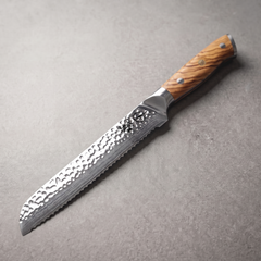 Silver Dynasty 8-inch serrated bread knife in 67-layer mirror-polished Damascus with olive wood burl handle