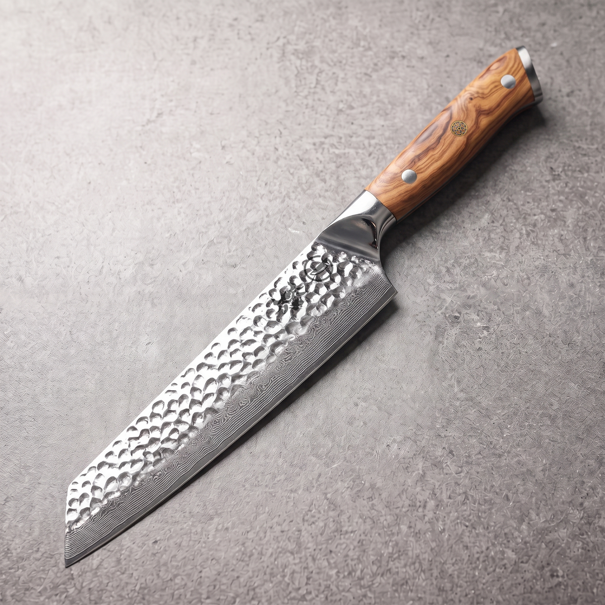 Silver Dynasty 8-inch kiritsuke knife with angled k-tip in 67-layer Damascus and olive wood burl full tang handle
