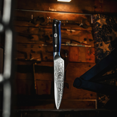 Ford F-150 50th Anniversary chef knife in the hand during kitchen prep