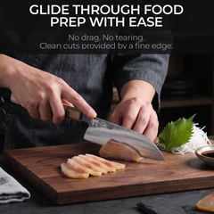 Torii 7-inch santoku knife slicing vegetables on a board
