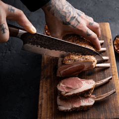 Dynasty Series 8-inch chef knife slicing on a board