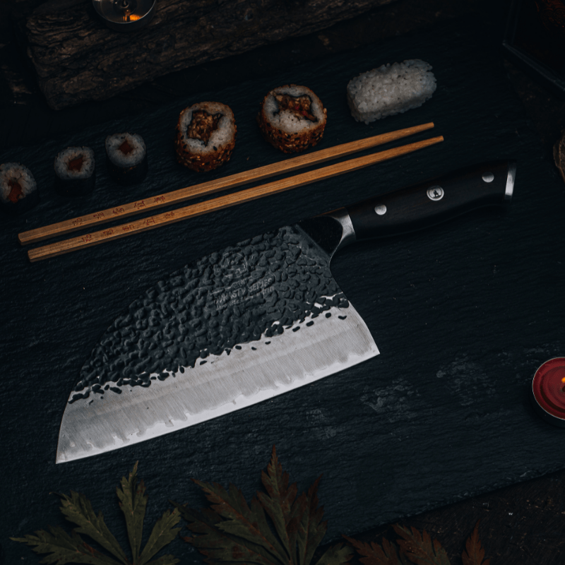 Serbian cleaver slicing prepared fish on a wooden board